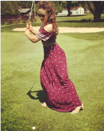 Picture of Eliza Butterworth while playing golf.